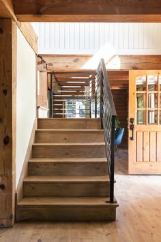 the stairs are made of wood and have metal handrails