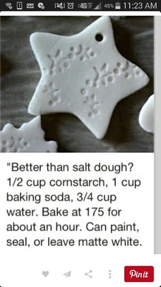 an image of some white cookies with words written on the top and bottom one has a star shaped cookie