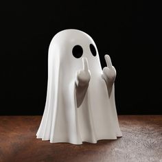 two white ghost statues with their hands in the shape of thumbs up and fingers down