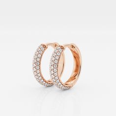 The Bombë Micro Huggie is a luxurious take on an everyday favorite. A miniature version of a classic hoop earring, these 14K gold diamond huggie earrings exude elegance and contemporary style. Three rows of lab grown pave diamonds embellish the curved shape of the earrings, encouraging you to dazzle from every angle. Timeless Rose Gold Hoop Earrings For Anniversary, Classic Rose Gold Diamond Huggie Earrings, Rose Gold Diamond Hoop Earrings With Brilliant Cut, Rose Gold Hoop Earrings With Brilliant Cut Diamonds, Rose Gold Vvs Clarity Huggie Diamond Earrings, 14k Rose Gold Hoop Earrings With Prong Setting, Rose Gold 14k Hoop Earrings With Prong Setting, Classic Rose Gold Huggie Earrings With Brilliant Cut, Classic Rose Gold Huggie Diamond Earrings