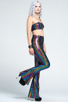 "Funky sparkly holographic rainbow bell bottom leggings with high waist. These fun, futuristic, psychedelic flares are super stretchy! The perfect flared pants for any dark, Burning Man, disco, festival, streetwear, flow, dance wear, mermaid, EDM, 70s, rave, robot, rocker or boho wardrobe! You can find the size chart in the last photo of the listing. If you want a custom inseam, please choose the SIZE WITH CUSTOM INSEAM option in the drop down box, and specify your custom finished inseam in the Rave Style Bottoms For Halloween Festival, Stretch Multicolor Party Pants, Multicolor Stretch Pants For Party, Stretch Multicolor Pants For Party, Fitted Disco Glitter Pants, Fitted Glitter Disco Pants, Fitted Disco Pants With Glitter, Multicolor Sequined Bottoms For Party Season, Sequin Disco Bottoms For Costume Party