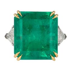 Impressive Colombian emerald with diamond three-stone ring. Superb electric green color and a very lively stones, pictures do not do it justice. High jewelry by Alexander Beverly Hills. GIA certified 24.25 carat Colombian emerald complemented with 2 trilliant diamonds, 1.41ct. Approximately G/H color and SI clarity. 25.66ct total gemstone weight, in platinum and 18k yellow gold, current ring size 6.5. Accommodated with an up-to-date appraisal by a GIA G.G. once purchased, upon request. Please co Stones Pictures, Columbian Emeralds, Emerald And Diamond Ring, Electric Green, Emerald Diamond Ring, 3 Stone Rings, Colombian Emeralds, Shiny Things, Platinum Ring