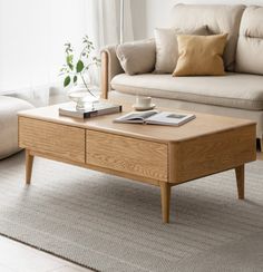 a wooden coffee table sitting on top of a carpeted floor next to a couch