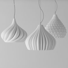 three white lamps hanging from the ceiling