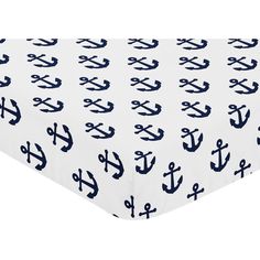 an image of a bed sheet with navy anchor print on it and white sheetspread