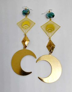 Brass crescent moon earrings with crystal cut glass beads. Approximately 4 1/4" inches in length. Ear hooks are .925 sterling silver. Nickel-free Celestial Crystal Earrings, Metal Crescent Moon Phase Earrings, Pierced Metal Half Moon Jewelry, Crescent-shaped Metal Ear Wire Jewelry, Pierced Half Moon Metal Jewelry, Half Moon Pierced Metal Jewelry, Adjustable Half Moon Earrings, Metal Dangle Crystal Earrings With Moon Charm, Crescent Moon Earrings