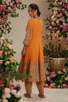 Peach orange georgette long anarkali with intricate gota work in floral pattern. Comes with matching salwar and pure organza dupatta.
Components: 3
Pattern: Embroidered
Type Of Work: Gota
Neckline: Round
Sleeve Type: Three Quarter
Fabric: Anarkali and Salwar: Georgette, Dupatta: Organza
Color: Peach,Orange
Other Details: 
Embellished show buttons
Kiran border dupatta
Model height: 5ft 7inches, wearing size S
Closure:
Kurta: Front hook and eye
Salwar: Drawstring tie-up
Occasion: Wedding,Puja - Az Luxury Orange Gota Work Anarkali Set, Festive Peach Anarkali Salwar Kameez, Orange Georgette Sharara With Zari Work, Peach Anarkali Salwar Kameez With Straight Kurta, Peach Traditional Wear With Mirror Work For Diwali, Festive Traditional Peach Anarkali Set, Orange Chanderi Salwar Kameez With Zari Work, Designer Orange Kurta With Dabka Work, Orange Georgette Traditional Wear With Mirror Work