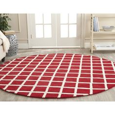 a red and white rug in a living room