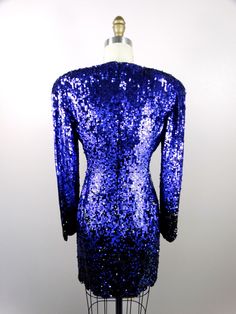 "Such an amazing cocktail dress! Fully embellished with sequins in a purple-to-black ombre design. It's in excellent condition! Measurements: Bust - 34\" Waist - 26\" Hips - 36\" Length - 33\" Tag Size - 4 This dress comes from a pet-free and smoke-free home. If you would like more info or have any questions, please don't hesitate to ask!" Purple Embellished Sequin Evening Dress, Purple Sequin Dress With Contrast Sequin For Evening, Fitted Purple Dress With Contrast Sequin, Purple Embellished Sequin Cocktail Dress, Purple Fitted Sequin Evening Dress, Purple Embellished Sequin Dress For Cocktail, Embellished Purple Sequin Cocktail Dress, Purple Glamorous Sequin Fabric For Evening, Fitted Purple Sequin Evening Dress