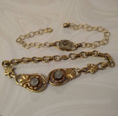 2 delicate vintage camphor glass gold filled link bracelets make a nice pairing. Choose one or both. The 7.75" one has two tiny camphor glass settings with rose gold halo around. Its tiny filigree foldover snap clasp is marked 1/20 12KT. The 7.25" open link one is marked 1/20 12KT ON STERLING on its hinged clip clasp. Both clasps work well and both bracelets are in good vintage condition. I'm not certain how the miniscule rhinestones are mounted. Rhinestone Bracelets, Rose Gold Halo, Alexandria Va, Bracelets Gold, Gold Halo, Touch Of Gold, Rhinestone Bracelet, The 8, Glass Set