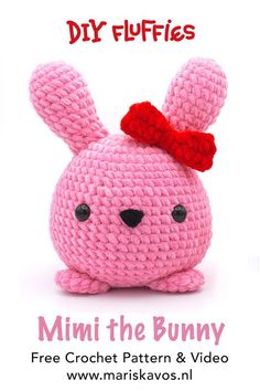 a pink crocheted bunny with a red bow on its head and the words mini the bunny below it