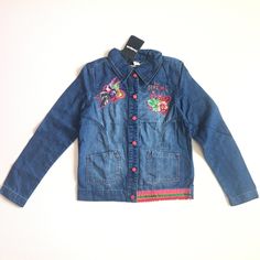 Desigual Girls Chaq Puqui Denim Jacket Size 13/14 Style: 71e34j5 Denim Jacket With Applique And Embroidery Shell-80% Cotton, 20% Polyester;Lining-95% Polyester, 5% Cotton Please Note-Fabric Is Light Weight Denim (Similar To A Denim Shirt) Measurements (Approximately In Inches, Laid Flat): Chest (Armpit To Armpit)-17.00 Shoulders (Seam To Seam)-15.00 Length (Top Of Collar To Bottom Hem)-23.00 Sleeve Length (Shoulder Seam To Sleeve End)-23.75 Playful Denim Outerwear For Winter, Playful Denim Outerwear For Spring, Playful Blue Denim Jacket For Fall, Playful Blue Denim Jacket With Pockets, Jean Jacket For Girls, Girls Denim Jacket, Crop Jean Jacket, Girls Denim, Size 13