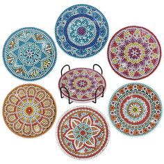 six circular beaded coasters in various colors and sizes, each with different designs on them