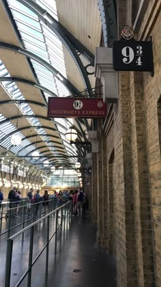 people are lined up in line at the station for their next ride to the subway