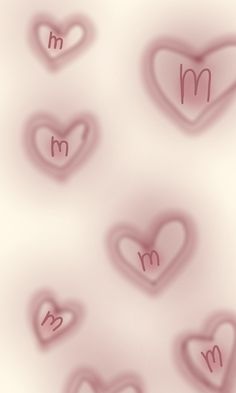 many hearts are arranged in the shape of m and m on a white background with pink highlights