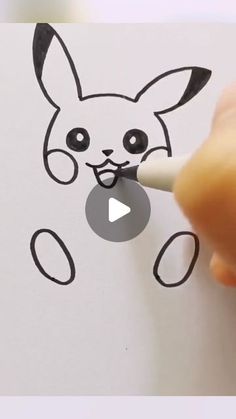 someone is drawing a cartoon dog on paper