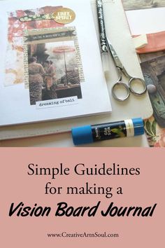 an open book sitting on top of a table next to scissors and other crafting supplies