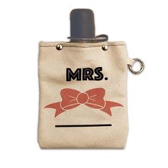 a bag with a bow on it and the words mrs written in black ink is shown