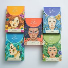 four boxes of tea with different designs on them, each featuring an image of a woman's face