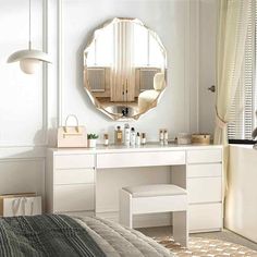 a bedroom with a vanity, mirror and stool next to a window in the room