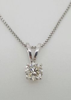 Visit My eBay Store: Amin Jewelers Very beautiful and elegant natural round brilliant cut diamond 14k solid white gold pendant and chain. Total weight: 1.9 grams Diamond weight: 0.46 Ct, 4.9*3.07MM Clarity: I1 Color: I Chain length: 20" Chain thickness: 0.7MM COMES IN A NICE GIFT BOX! YOUR SATISFACTION IS GUARANTEED! Please add me to your Favorites list CLICK HERE FOR MORE CHAINS CLICK HERE FOR MORE PENDANTS & NECKLACES Visit My eBay Store: Amin Jewelers Please review the description, item condition and pictures carefully before shopping, Thank you! Choking Hazard Small Parts WARNING: CHOKING HAZARD Small Parts Not for children under 3 yrs. Use with adult supervision only. Fine Gold Necklace, White Gold Solitaire, White Gold Pendant, Solitaire Pendant, Fine Jewellery Necklace, Brilliant Diamond, Round Brilliant Cut Diamond, Brilliant Cut Diamond, Round Brilliant