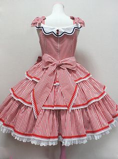 a red and white striped dress on a mannequin