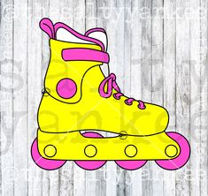 a pair of yellow roller skates with pink and white wheels on a wooden background