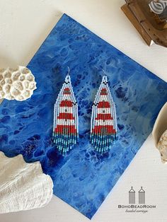 These lighthouse beaded earrings will always remind you about sea and vacation. Long fringe seed bead earrings are made from selected Czech bead. Drop Dangle beaded earrings can be cute gift for your loved ones. ♡ Bead Length - 3.7'' (9 Centimeters) ♡ Total Length - 3.9'' (10 Centimeters) ♡ Width - 1.2'' (3 Centimeters) ♡ Quality Czech beads ♡ Stainless steel mounts If you like these dangle fringe seed bead earrings but would like them in a different color or size please email me and I do a spec Beach Beaded Drop Earrings With Tiny Beads, Colorful Beaded Dangle Earrings For Beach, Beach Tiny Beads Drop Earrings, Tiny Beads Drop Earrings For Beach, Tiny Beaded Drop Earrings For Beach, Colorful Beaded Earrings For The Beach, Colorful Beaded Round Earrings For Beach, Colorful Beaded Earrings For Beach, Colorful Round Beaded Earrings For Beach