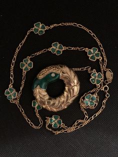 Lanvin's designer necklace consisting of clovers measuring 1.4 cm enamelled in green color and a gold metal medallion and crystals measuring 5 cmSmall imperfections is a vintage product Green Vintage Charm Pendant Jewelry, Green Pendant Jewelry With Vintage Charm, Formal Green Locket Necklace, Green Medallion Necklace For Formal Occasions, Vintage Green Necklace With Chain, Antique Green Jewelry With Vintage Charm, Victorian Gold Enamel Necklace, Antique Green Locket Jewelry, Luxury Green Medallion Necklace