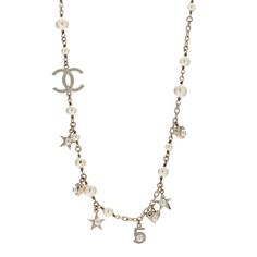 This is an authentic CHANEL Metal Crystal Pearl CC Star Short Necklace in Gold.This stylish necklace is just below the collar andcrafted in gold tone chainand features a Chanel CC crystal encrusted logo, hanging charms with faux pearls and crystals, and pearls of graduated sizes. Short Necklace Gold, Hanging Charms, Chanel Necklace, Stylish Necklace, Short Necklace, Crystal Pearls, Necklace Gold, Faux Pearl, Gold Tones