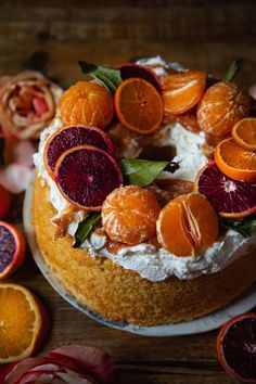 there is a cake with oranges on it