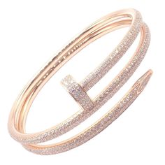 About This Piece: The Cartier Juste un Clou Nail Bangle is an exquisite bracelet crafted in 18k rose gold, adorned with sparkling diamonds. Shaped like a bent nail, it epitomizes bold elegance. This size 16 piece comes with papers, ensuring... Rose Gold Cartier, Cartier Nail Bracelet, Cartier Diamond Bracelet, Rose Gold Nail, Cartier Juste Un Clou, Nail Bangle, Chanel Ring, Nail Bracelet, Diamond Bangle Bracelet