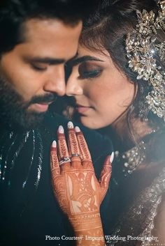 a bride and groom with their hands together