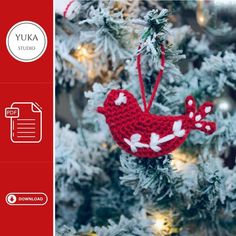 a crocheted bird ornament hanging from a christmas tree