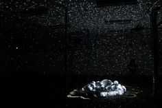 an abstract black and white photo with stars in the sky above some balls on a floor