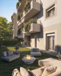 an artist's rendering of a modern apartment building with outdoor seating and fire pit