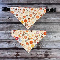 two dog bandanas with different types of food on them, one is yellow and the other is orange