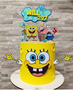 a yellow spongebob cake with decorations on top