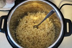 a pot filled with rice on top of a stove