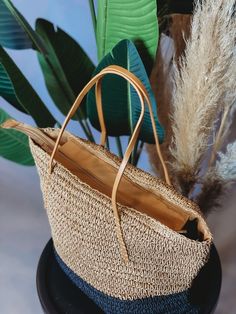 This stylish and sustainable Boho Living Straw Tote Bag is perfect for all your beach day needs! Made from natural jute, this tote is sure to turn heads with its neutral hues. No more lugging around your beach gear - pack it up in this tote bag for a fashionable way to hit the waves! Casual Everyday Bags Made Of Natural Fiber, Everyday Summer Straw Shoulder Bag, Everyday Summer Straw Bag For Spring, Spring Travel Bucket Bag In Natural Fiber, Spring Straw Bag, Everyday Straw Beach Bag For Spring, Trendy Straw Bag For Everyday Beach Use, Summer Beach Bag With Braided Handles For Everyday, Spring Straw Beach Bag For Everyday Use