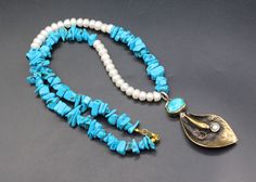 Brilliant! I am offering you unique necklace, Its 100% hand crafted workmanship with beautiful pearls and manmade turquoise stones with alpaka bronze leaf shape pendant necklace. Please do not hesitate to contact if you have any questions about items or further informations Measures  :  Size of long of the necklace : 23.2" ( 59 cm ) Length of Pendant : 2.8" ( 7 cm ) Width : 1" ( 2.5 cm ) Weight : 87.6 Grams, You will get all the pendants shown in pictures. Traditional Necklace, Colorful Necklace, Necklace Colorful, Beaded Leaf, Colourful Necklace, Leaf Shapes, Unique Necklaces, Turquoise Stone, Long Necklace