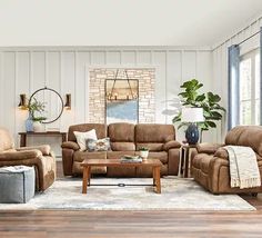 a living room with couches, chairs and a coffee table