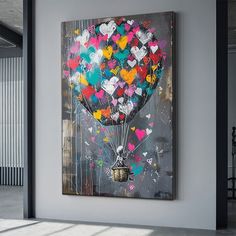 a large painting hanging on the side of a wall