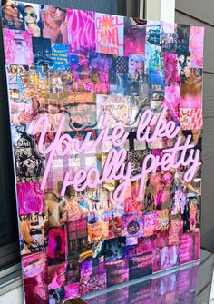 there is a sign that has been decorated with pictures and words in pink, purple, and blue