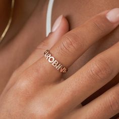 SAIGE RING Our unique Saige Name Ring features a set of special initials or a short name, woven into a curb chain band. You have the option to add a glistening heart, &, or star symbol, studded with cubic zirconia stones, for an extra-special touch. It's the perfect way to keep a special word, a short name, your birth year, or your initials close to your heart, and is sure to be a treasured keepsake for years to come. *RELATED PRODUCTS -- For a dainty cursive name ring: https://etsy.me/4dvjo1C *MATERIAL -- Cubic Zirconia Stones: On the symbols only -- 100% Recycled Sterling Silver: An everlasting classic that'll look as good as new with continuous care. -- 18K Gold Vermeil: Sterling silver base, plated with a durable and thick layer of 18-karat gold vermeil. -- 18K Rose Gold Vermeil: Sterl Rose Gold Jewelry With Initials For Promise, Rose Gold Name Jewelry For Promise, Rose Gold Promise Jewelry With Initials, Rose Gold Jewelry For Promise, Word Ring, Star Symbol, Word A, Name Ring, Letter Ring