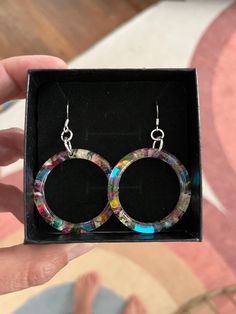 Handmade resin loop earrings with real dried and pressed flowers grown in my garden. The ear hooks are sterling silver French hooks. Beautiful and colorful earrings for any occasion! Ready to ship. ✨Real 925 sterling silver (925 stamped), sterling silver is hypoallergenic, nickel free - a good choice for people with sensitive skin ✨ Coated with a clear protective coating to help prevent silver from tarnishing or discoloring. Multicolor Nickel-free Flower Earrings, Nickel-free Multicolor Dangle Flower Earrings, Cheap Multicolor Nickel-free Plug Earrings, Nickel-free Multicolor Hoop Earrings, Affordable Flower-shaped Resin Earrings, Dried And Pressed Flowers, Loop Earrings, Colorful Earrings, Floral Earrings