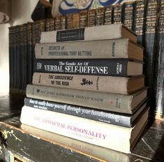 a stack of books sitting on top of a table