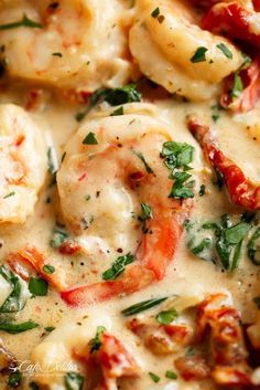 closeup of shrimp and spinach in white sauce