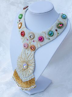 The 'Flowers of the field neckpiece was inspired by the innocent blue sky of the spring, the sparkling, shinig sun and the multicoloured fileds with hundreds of flowers. In this neckpiece I formed the sun with its rays and aery flowers of crystals, bicones and flower shaped beads.  This unique, eyecatching design provides its wearer an outstanding look with the fringes which are dangling freely and sparkingly.  I have used thousands of japanese seedbeads, crystals, Swarovsky bicon beads and Swar Swarovski Flowers, Necklace Tutorial, S Hook, Well Decor, Bugle Beads, Choker Necklaces, Bead Embroidery, Beaded Necklaces, Flower Shape