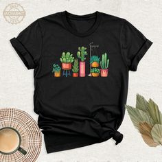 Cactus Plants Shirt, Botanical Tshirt, Floral Shirt, Gardening Tee, Succulent Tshirt, Plant Lovers Outfit, Cactus Lover Tee, Shirt for Women. Welcome to BestMomentTees! Step into a world of comfort and style with our handmade shirts from the renowned Bella Canvas brand. The solid colors are 100% pure cotton, while the delightful heather colors are a charming blend of 52% cotton and 48% polyester. 🍃 Each shirt is a true labor of love, meticulously created using the innovative DTF printing method Casual Shirt With Plant Print, Spring Relaxed Fit T-shirt With Plant Details, Casual Summer Tops With Plant Details, Casual Black T-shirt With Plant Print, Green Relaxed Fit T-shirt With Plant Detail, Casual Relaxed Fit T-shirt With Plants, Botanical Tshirt, Handmade Shirts, Cute Shirt Designs